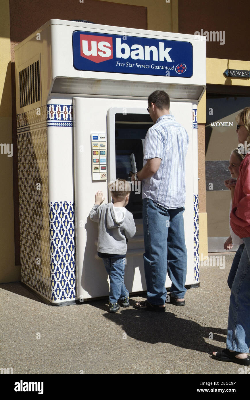 People drawing money from an ATM machine Stock Photo Alamy