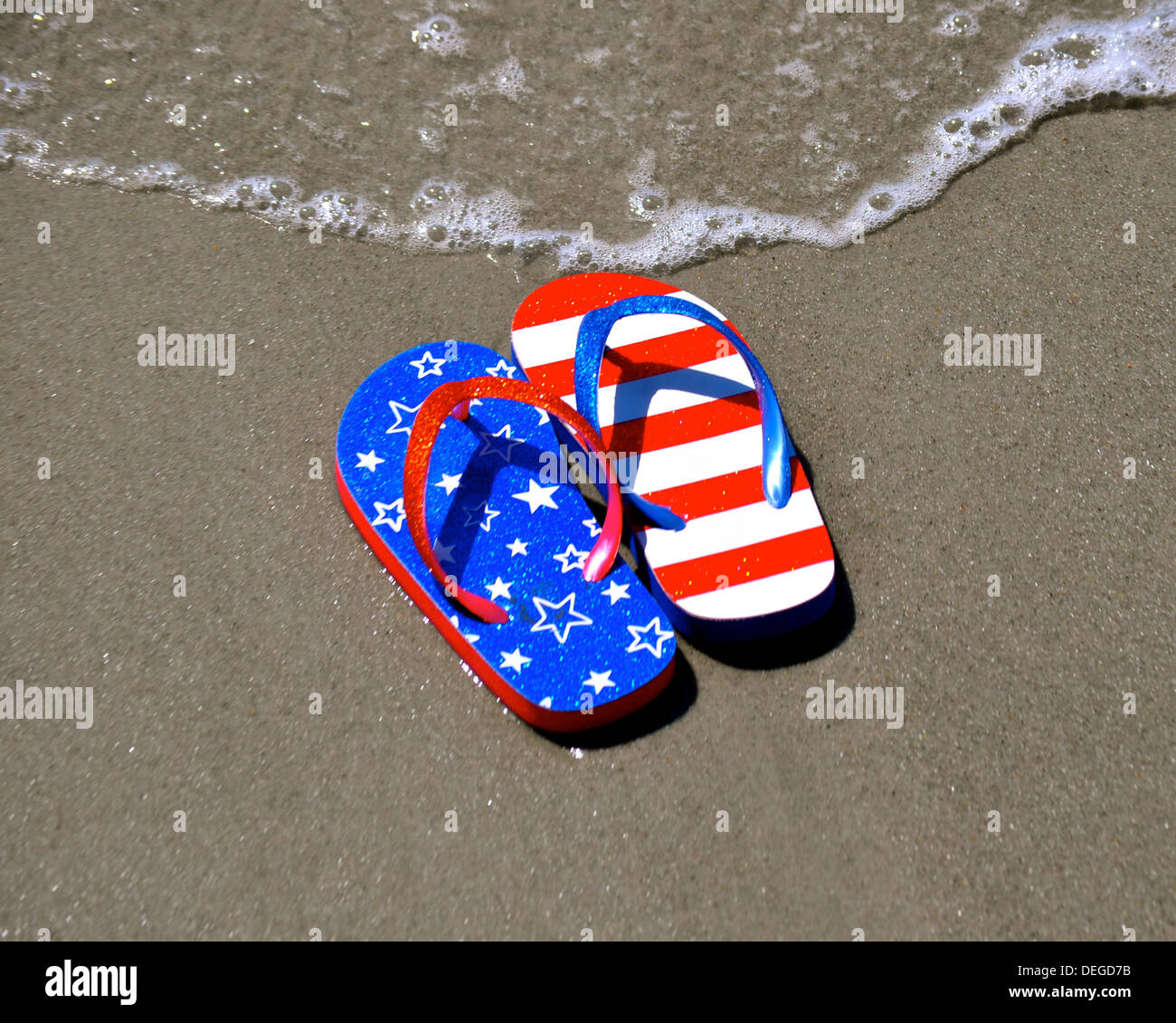 Flip Flops in the Sand Stock Photo - Alamy