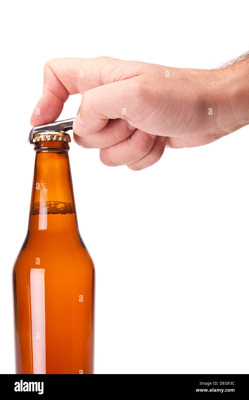 A hand opening a bottle of beer. Stock Photo