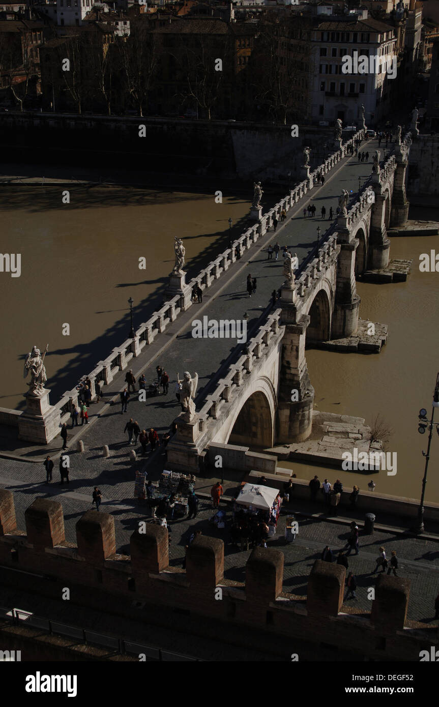Italy. Rome. People crossing Saint Angelo Bridge (1668-1671) over the Tiber river. Aerial view. Stock Photo