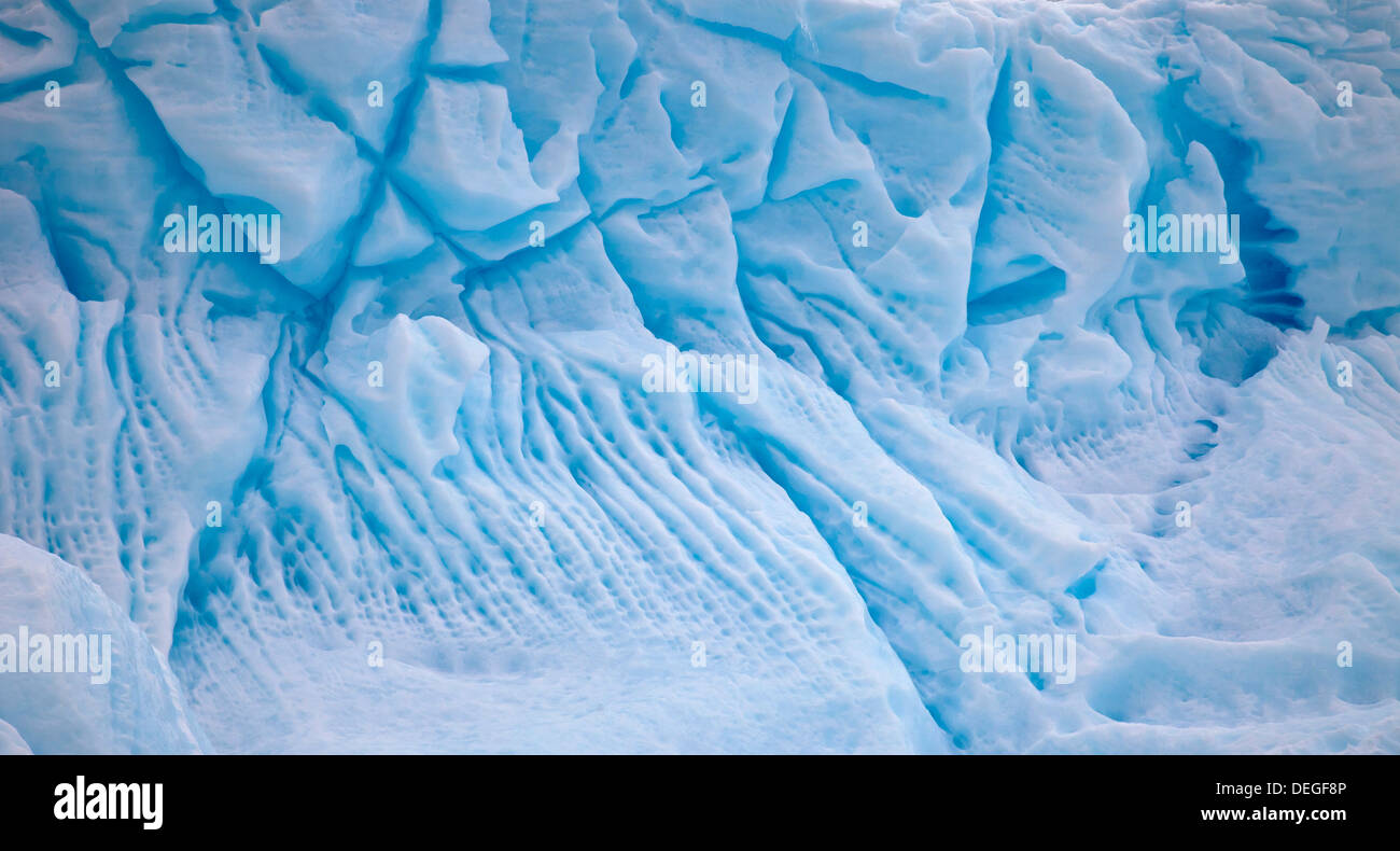 Eroded blue ice , underside of iceberg that has rolled over, Pleneau Island, Antarctic Peninsula. Stock Photo