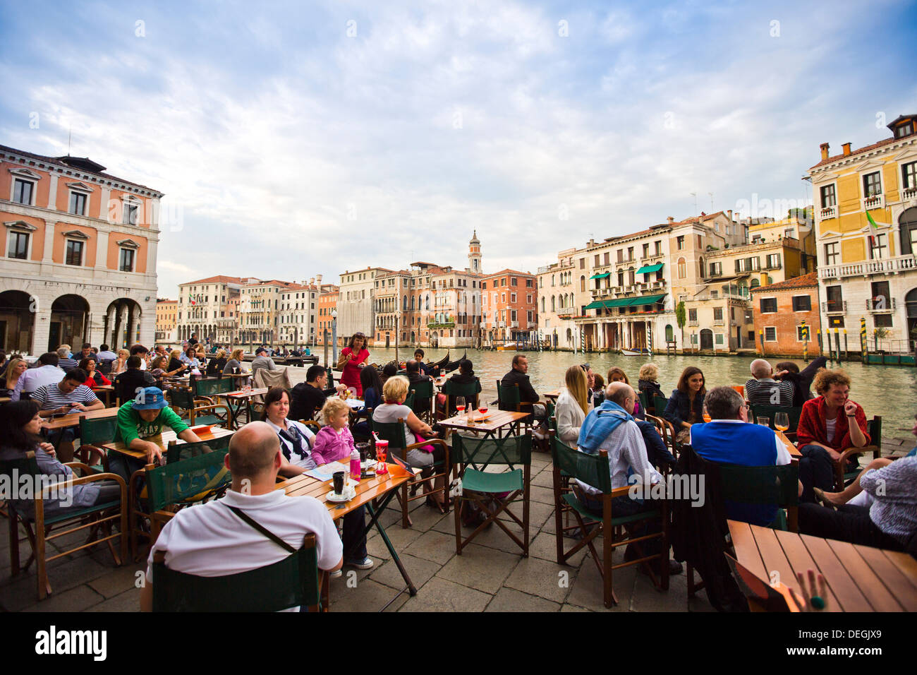 Tourists at outdoor restaurant at Grand Canal, Venice, Veneto, Italy Stock Photo