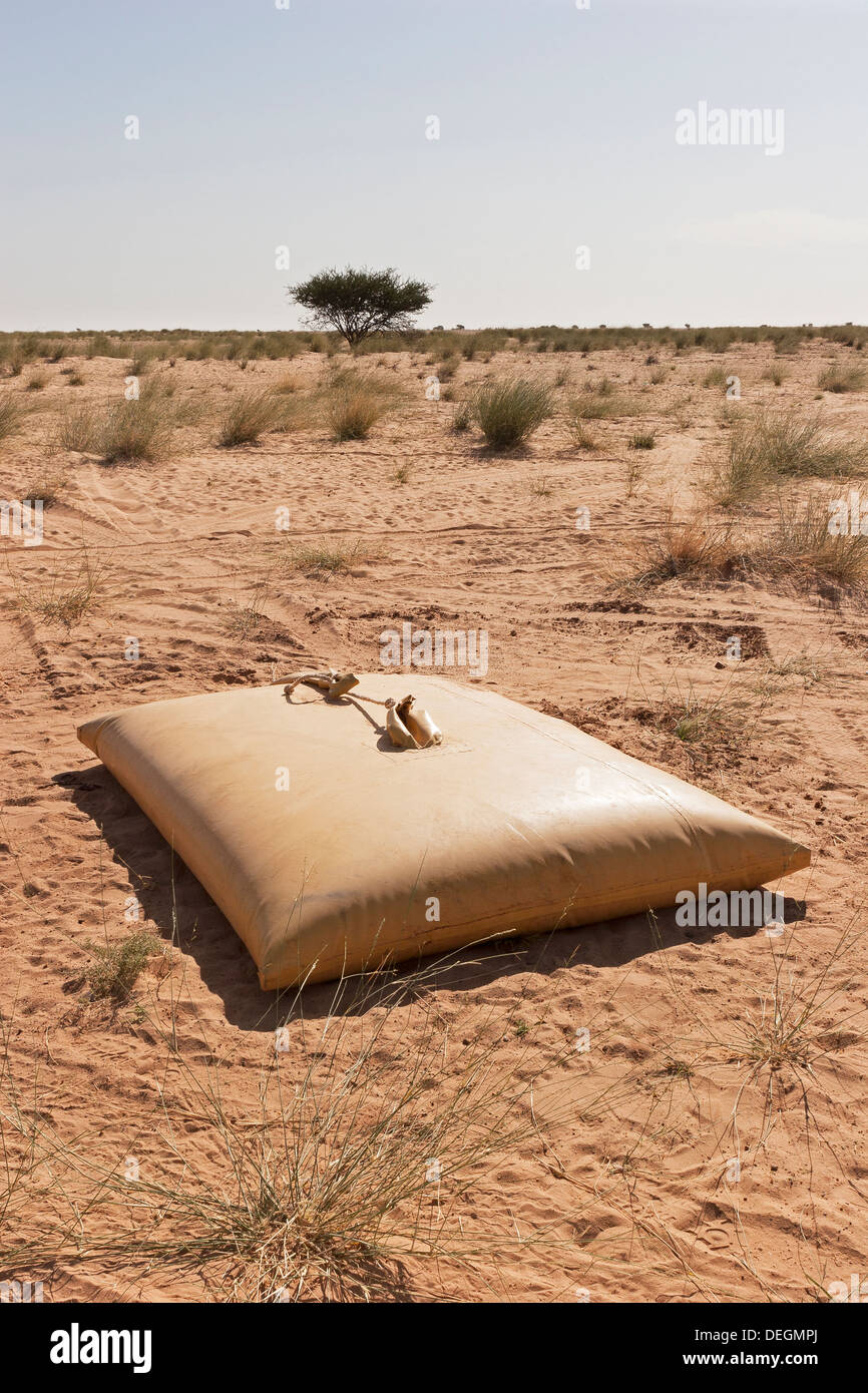 Potable water storage bladder in Sahara Desert, NW Mauritania, for use by nomadic communities in remote arid areas, Africa Stock Photo