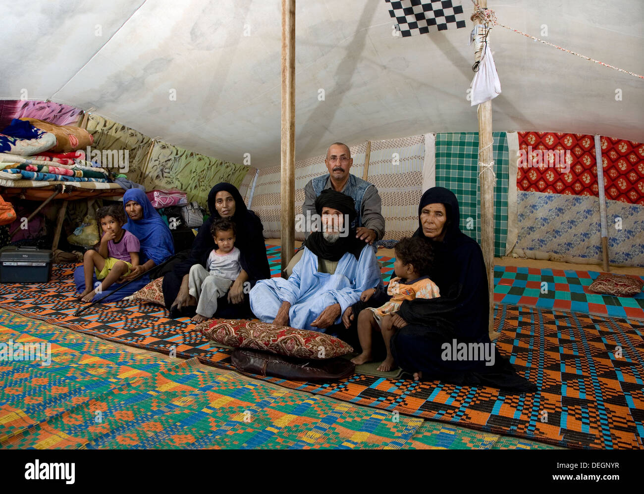 Islamic nomadic family inside their home tent with area community ...