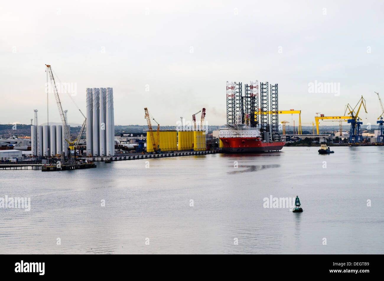 Wind turbine components waiting to be loaded onto Pacific Orca wind farm installation ship Stock Photo