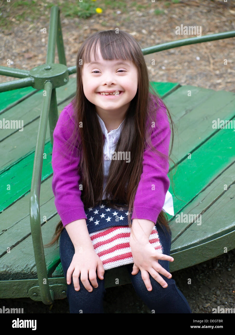 Portrait of beautiful young girl on the playground Stock Photo - Alamy