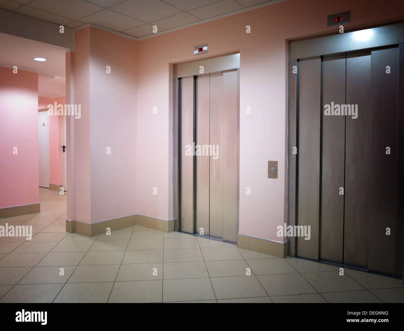Two closed modern elevators in a business lobby Stock Photo - Alamy