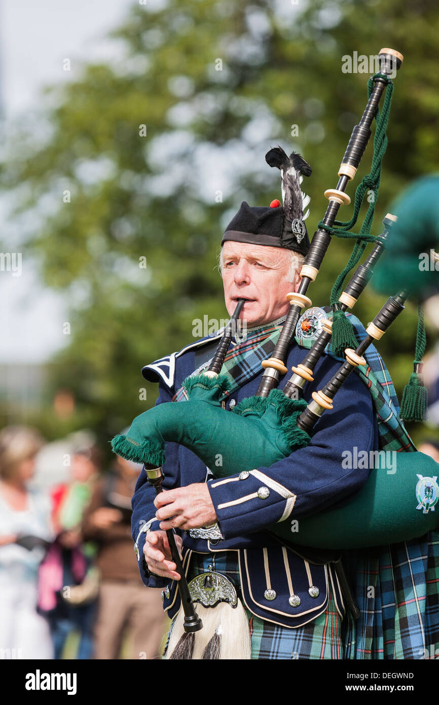 Piper at Lonach Highland games at Strathdon  in Aberdeenshire,Scotland Stock Photo