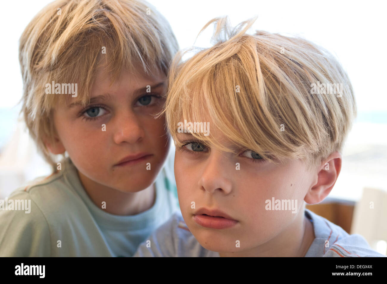 Two blond brothers look at the camera Stock Photo Alamy