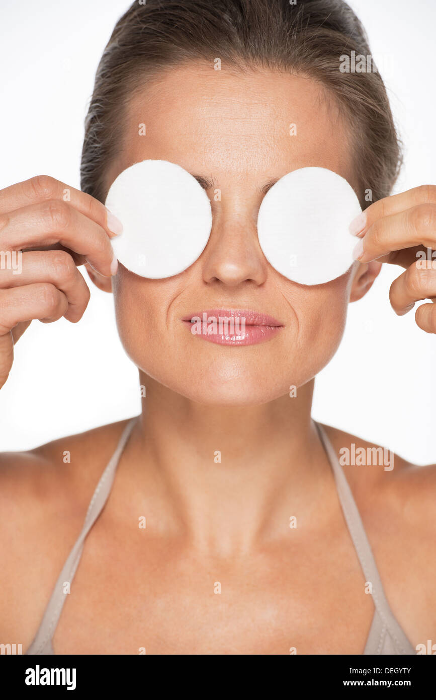 Woman holding cotton pads in front of eyes Stock Photo Alamy