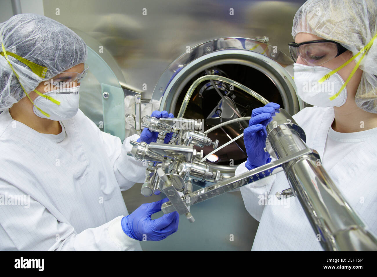 Technicians performing maintenance functions on a solid coating machine