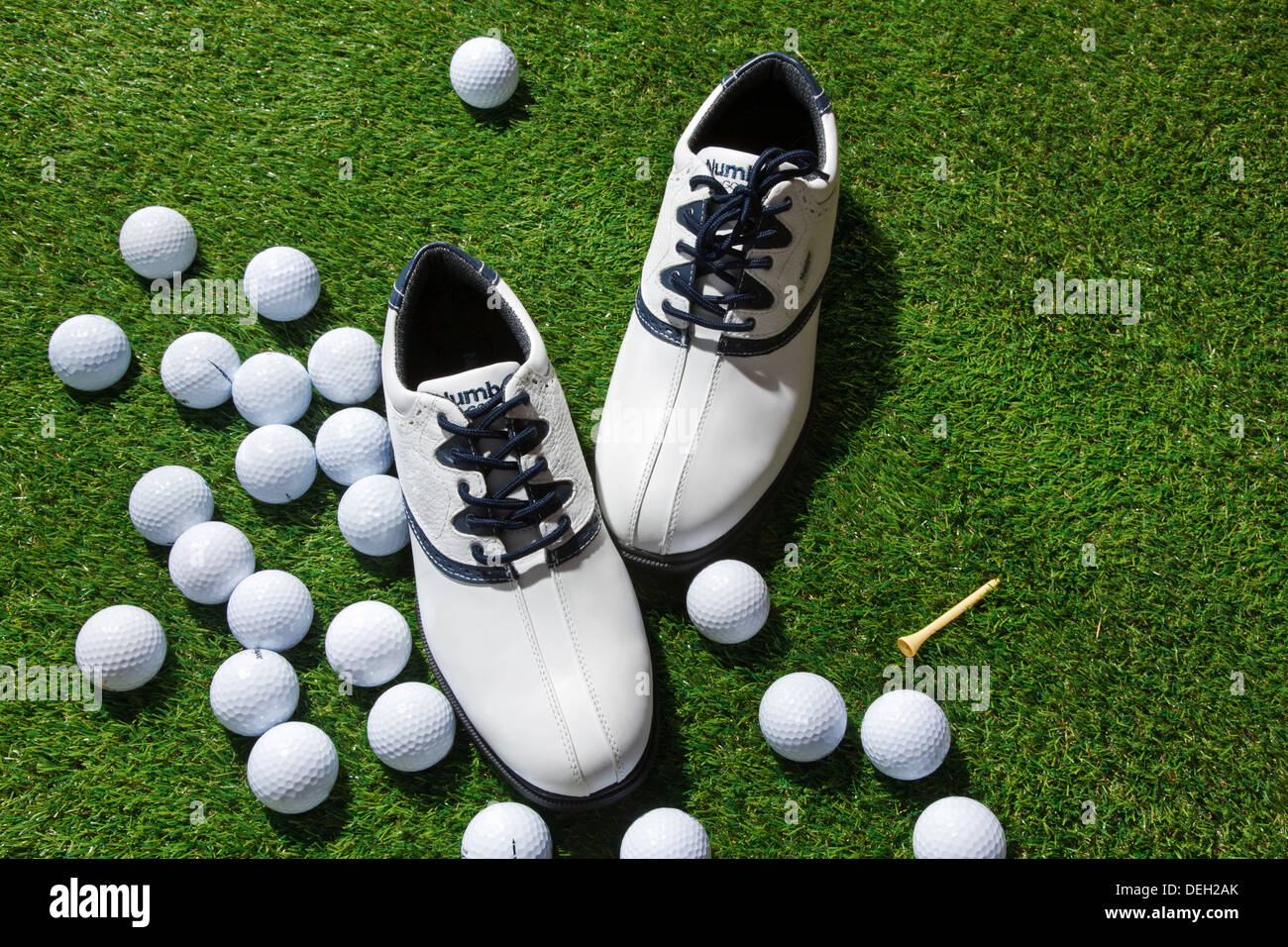 Golf shoes,tee and balls Stock Photo Alamy