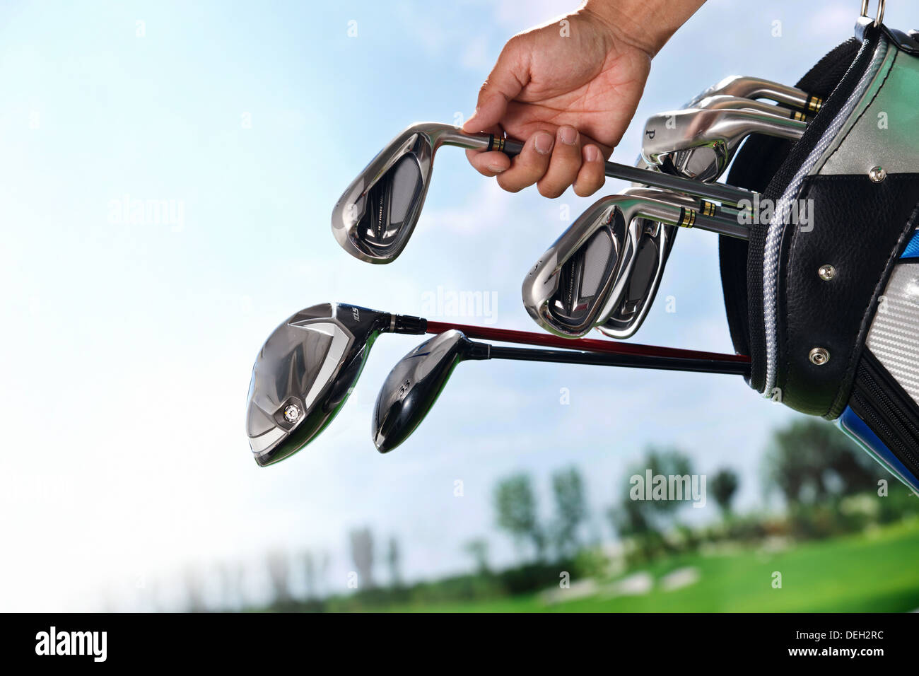 Removing golf club from bag Stock Photo Alamy