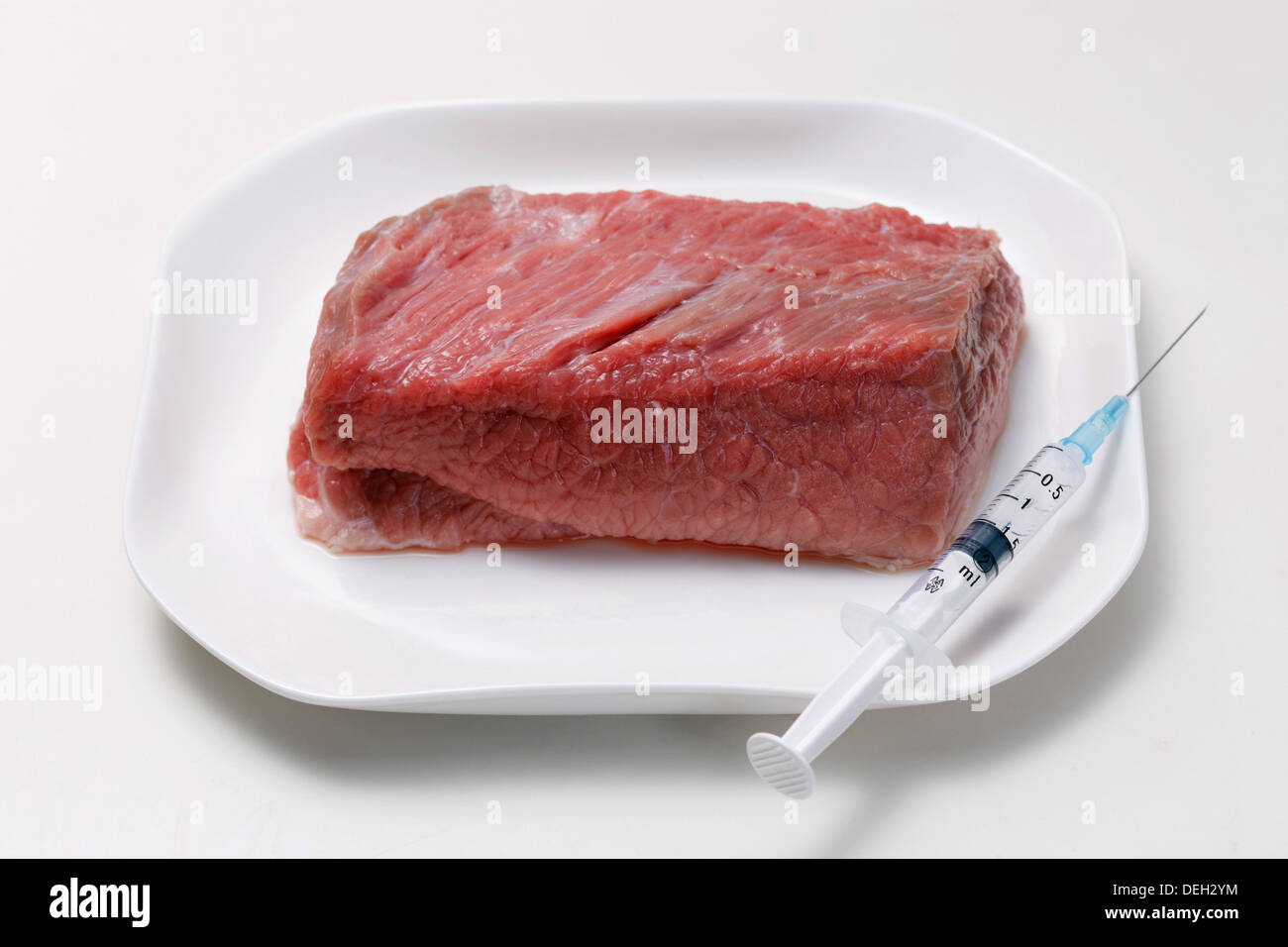 Raw meat and injector Stock Photo - Alamy