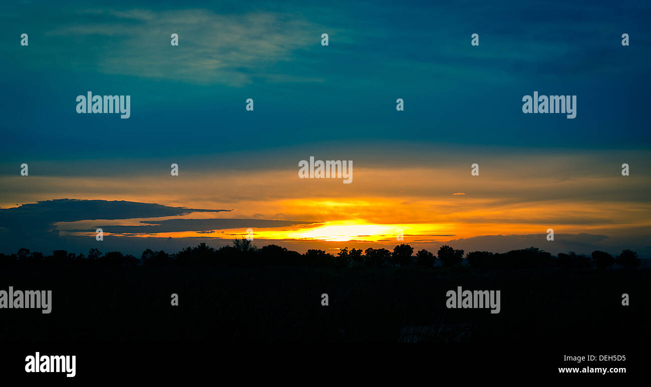 The Silhouette Landscape of Countryside Sunset View. Stock Photo