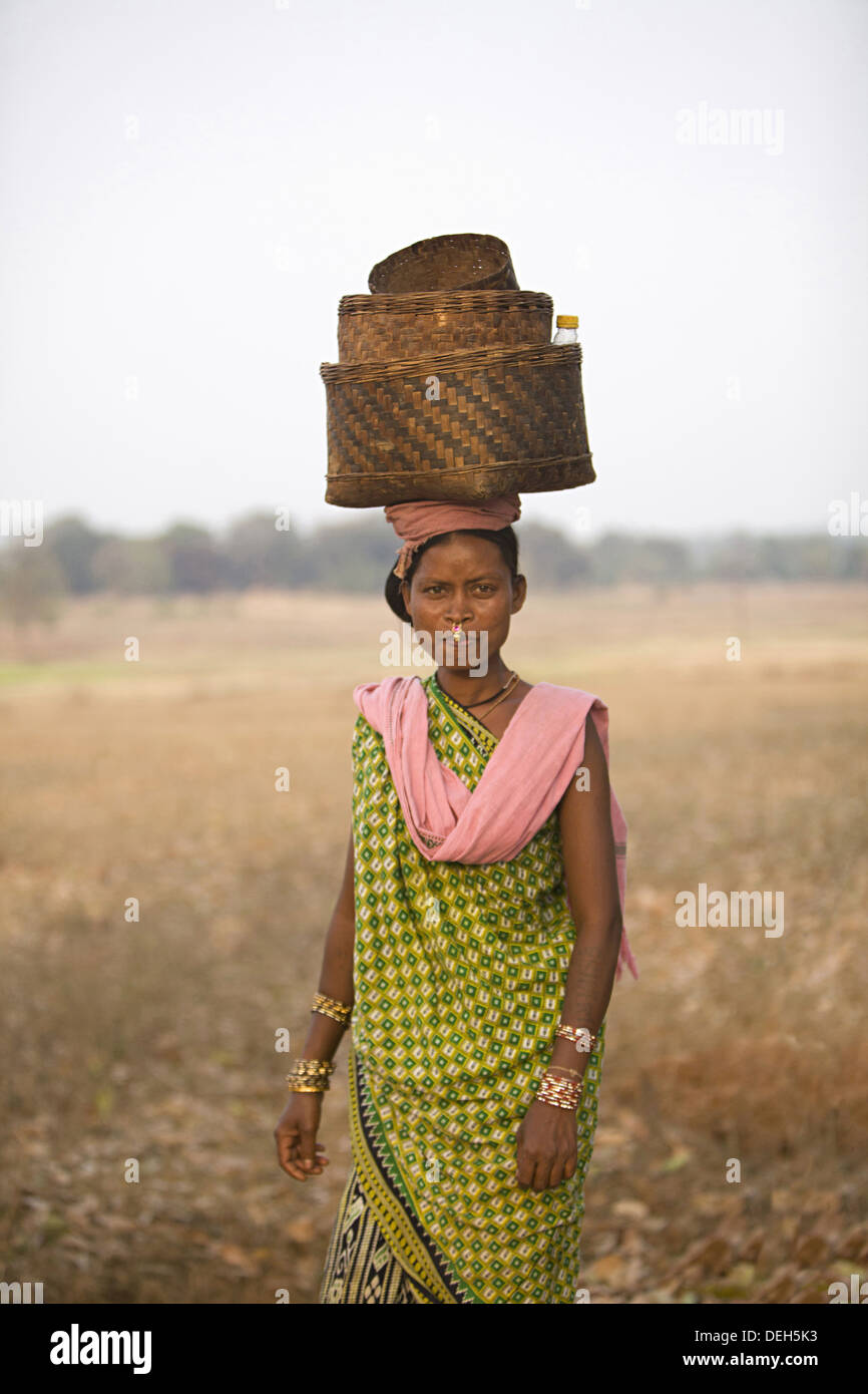 Woman with baskets on head, Orissa, India Stock Photo