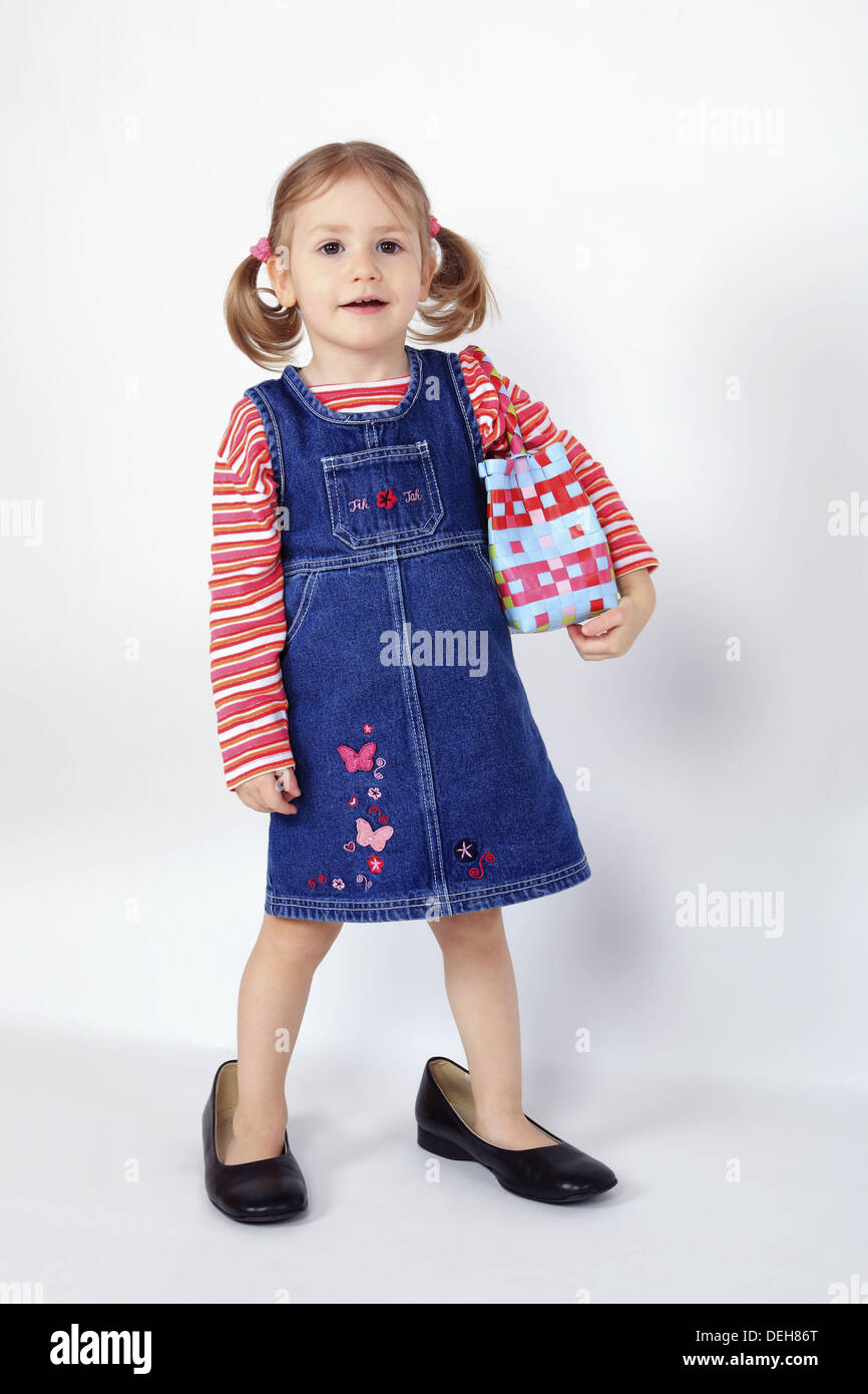 toddler, little girl, wearing dress and grown up dress shoes, standing