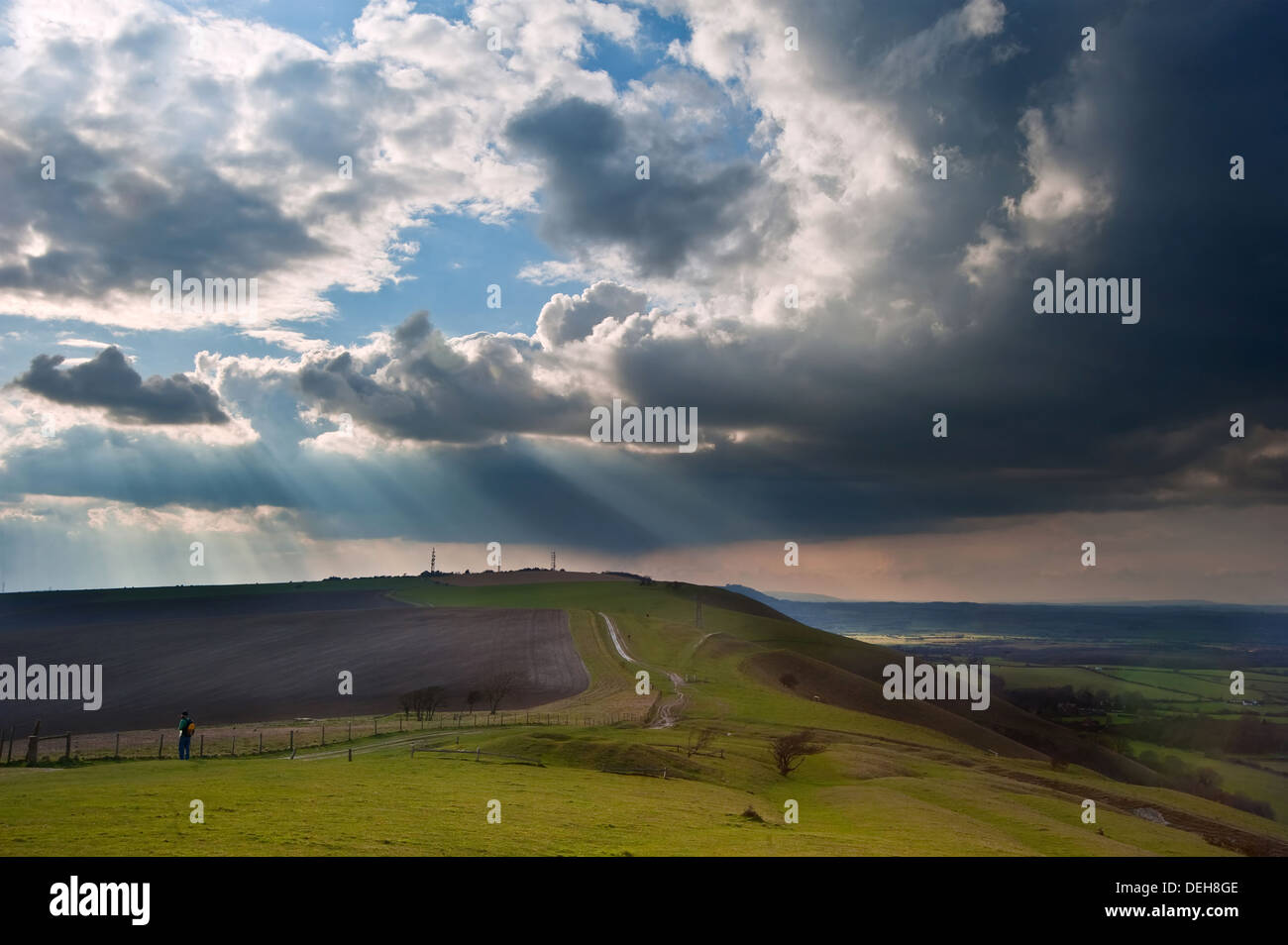 Beautiful countryside landscape across rolling hills with lovely cloud formations Stock Photo