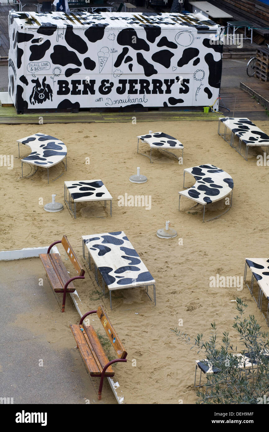 Ben and Jerry's Café with black and white tables on sand Stock Photo