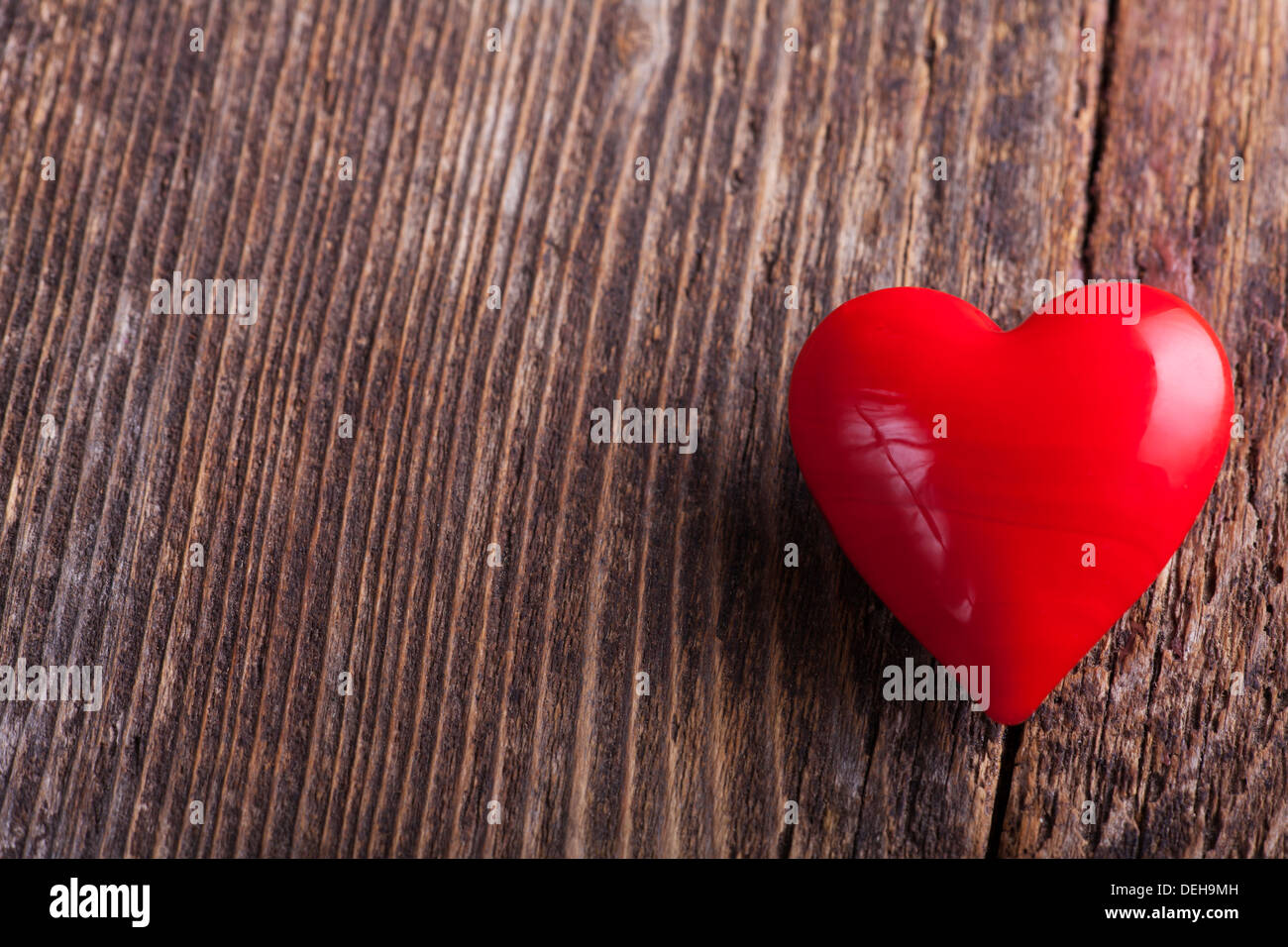 red heart on rough wood Stock Photo