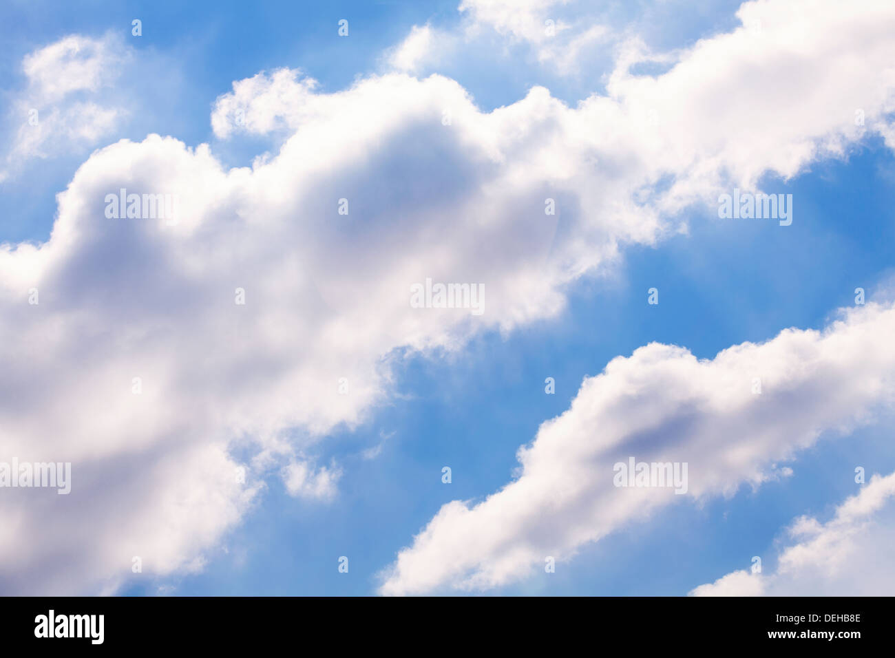puffy clouds sky shiny atmosphere Stock Photo
