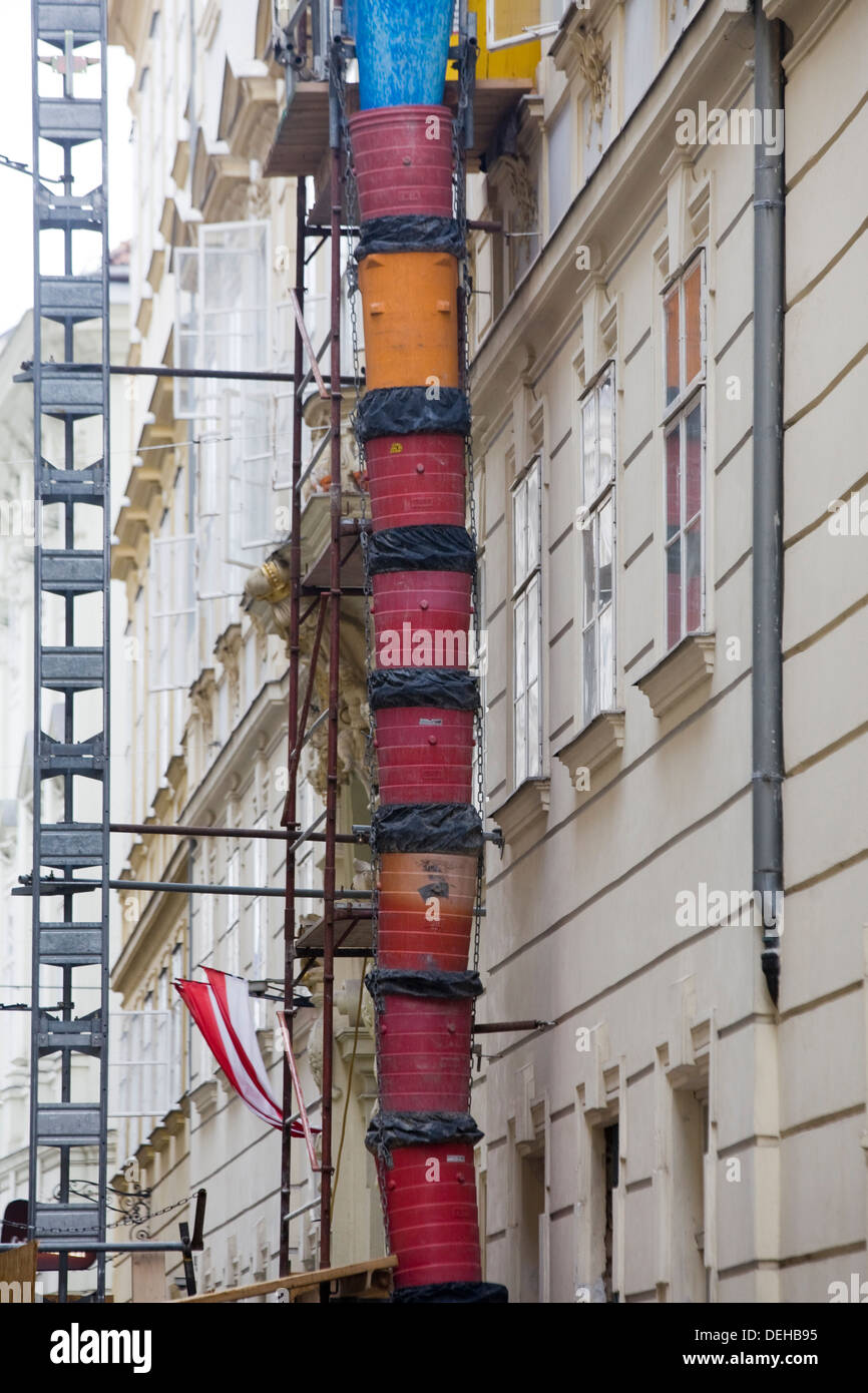 Rubble Chutes  on the side of a building with Scaffolding Stock Photo