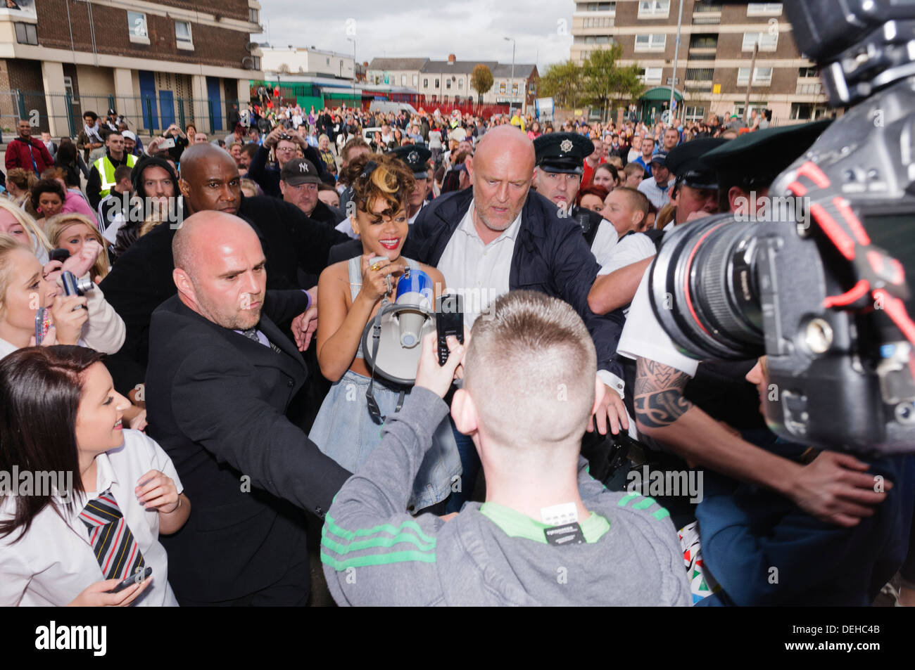 Norman Oosterbroek (The Dutch Giant), security bodyguard from South Africa, seen behind Rihana during her visit to Belfast Stock Photo