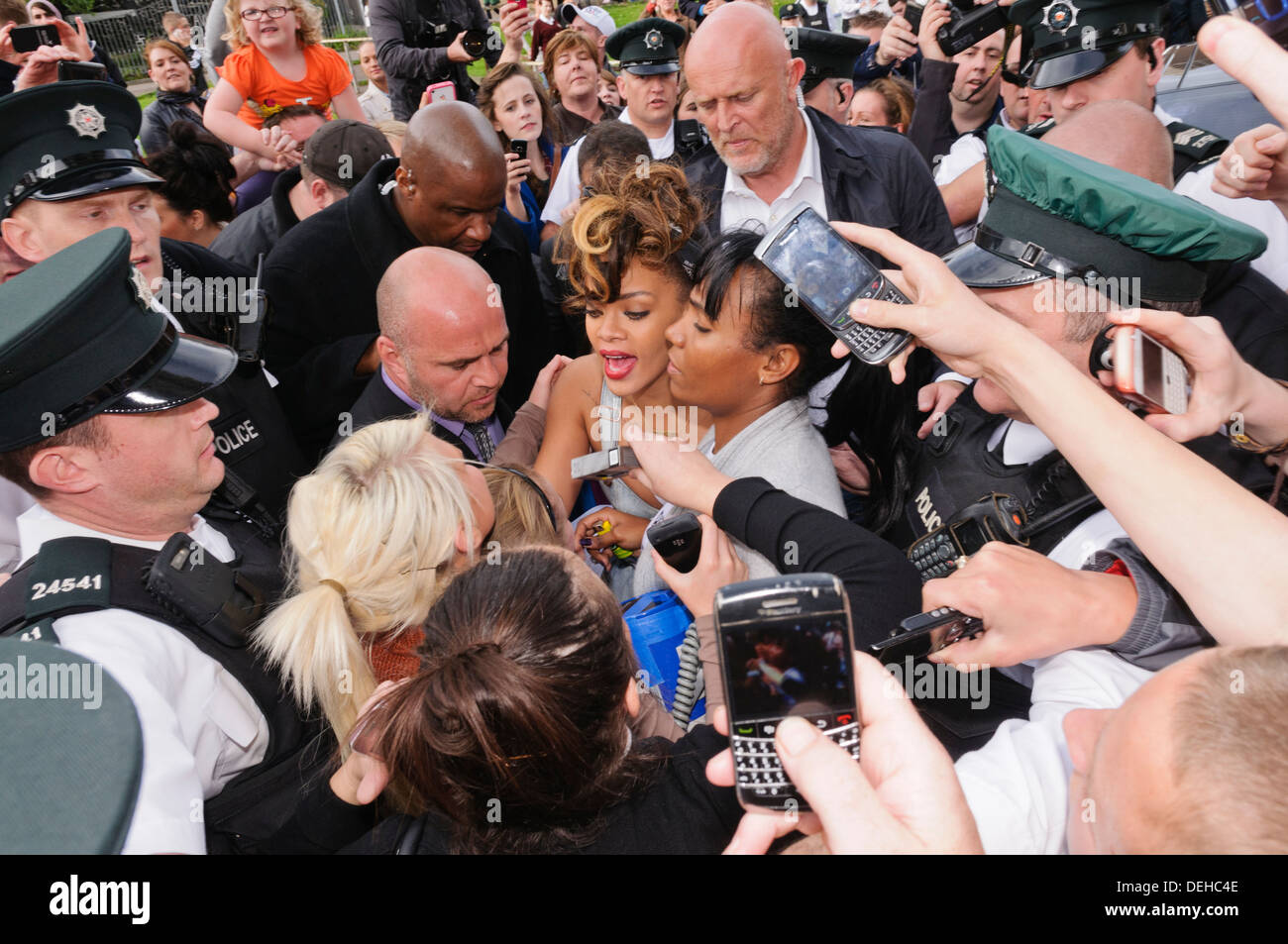 Norman Oosterbroek (The Dutch Giant), security bodyguard from South Africa, seen behind Rihana during her visit to Belfast Stock Photo