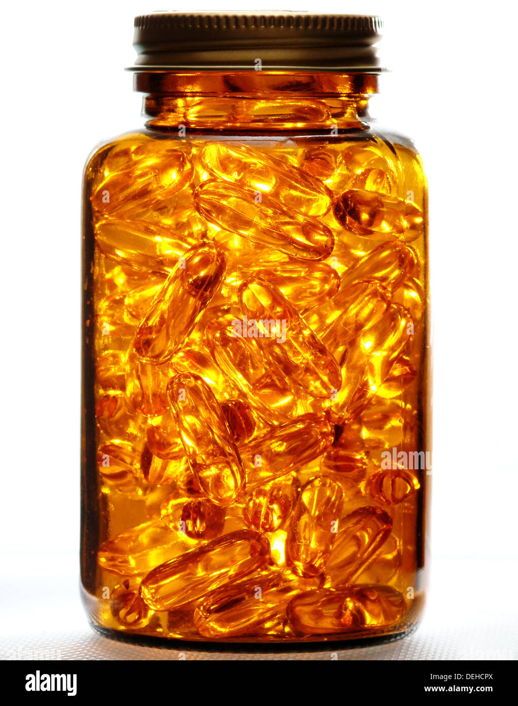 Vitamine E capsules in jar on white background Stock Photo Alamy