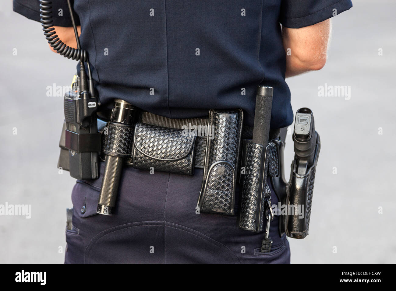 Equipment belt of an American uniformed Police Office showing his gun, baton and torch, Colorado, USA Stock Photo