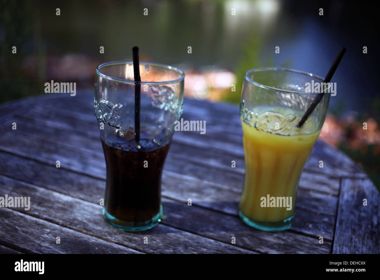 Soft drinks - Orange juice and coke glasses with straw - Durham ...