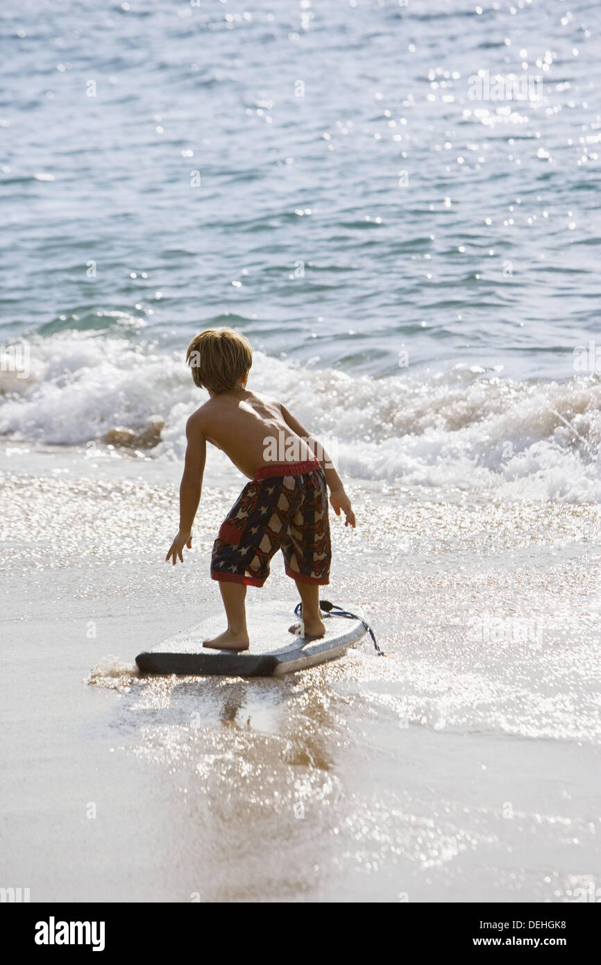 Boy boogie boarding, Maui, Hawaii, USA Stock Photo Alamy