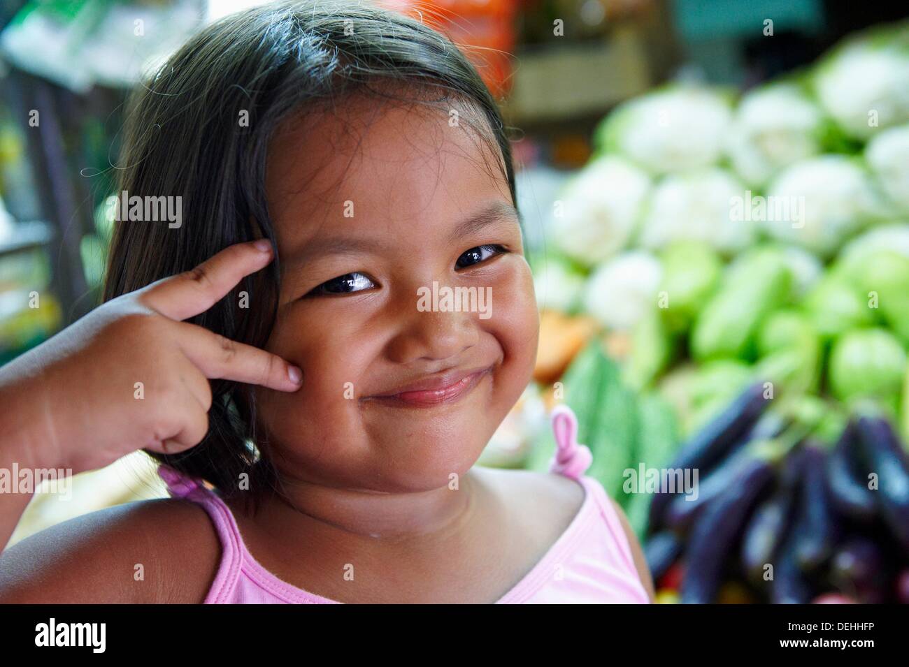 A filipino girl smile and look at camera Fruits & Vegetable market ...