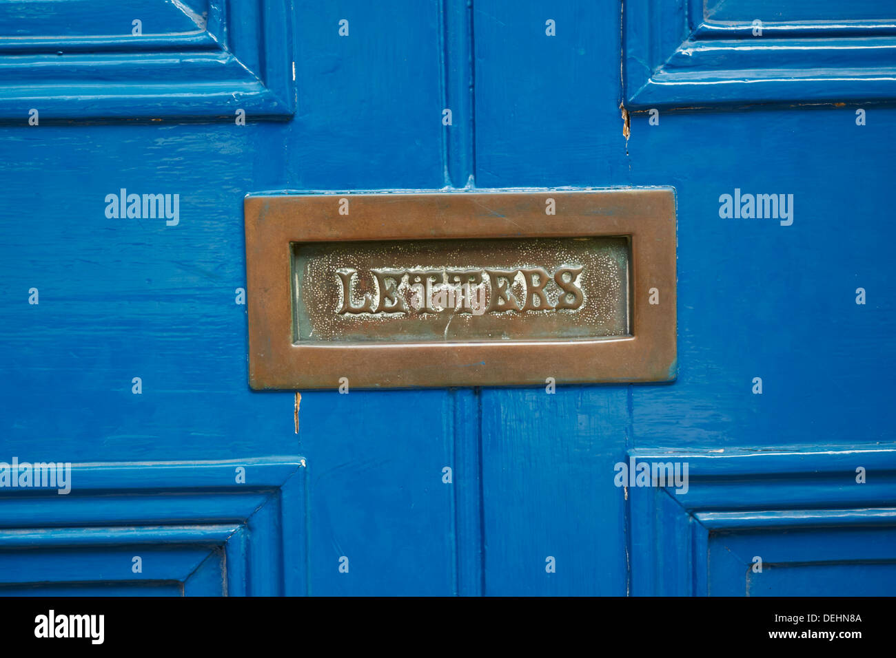 Letterbox on blue painted door Stock Photo