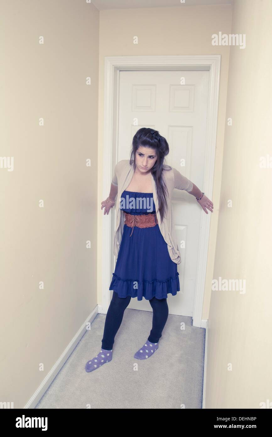 Teen girl in the hallway of her house Stock Photo - Alamy