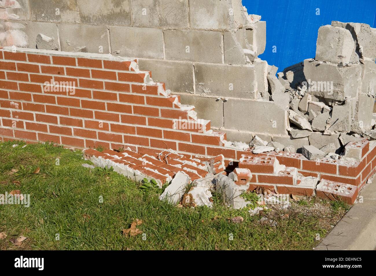 Red brick partially covering concrete blocks Stock Photo Alamy