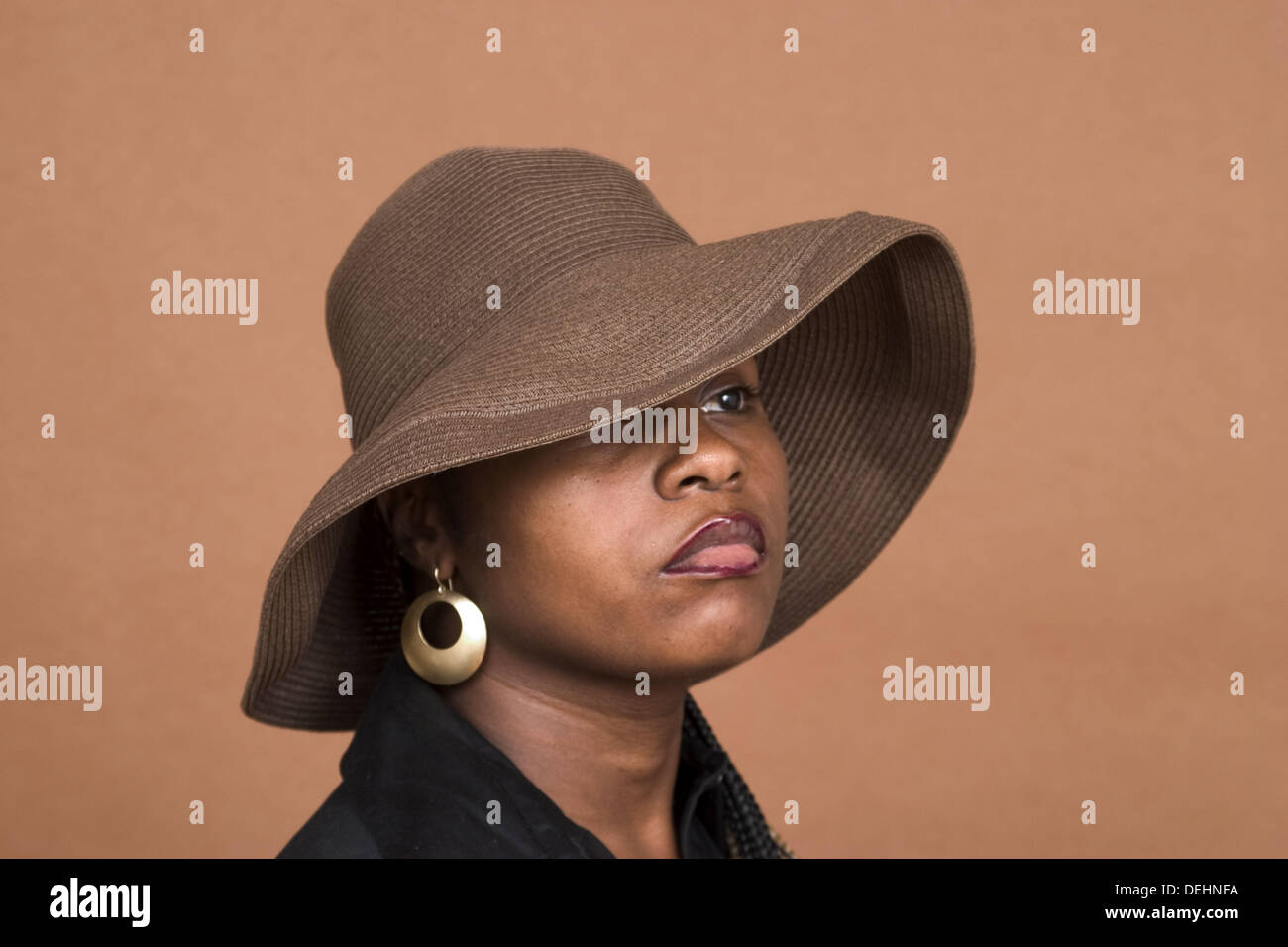 Young black woman, wearing a hat, posing Stock Photo Alamy