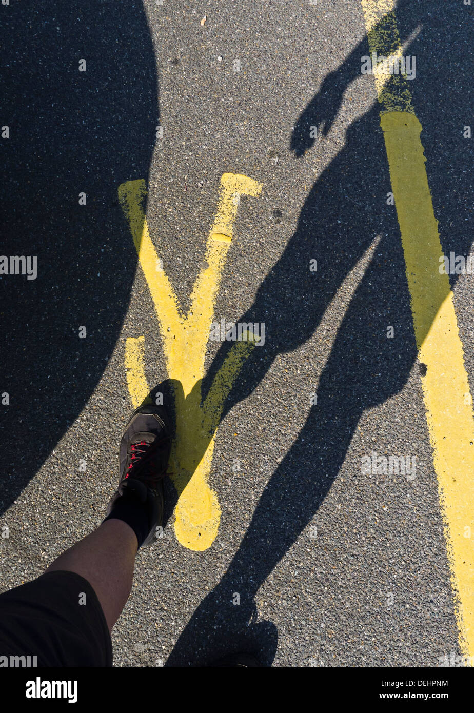 Shadow of a man walking in a pedestrian zone Stock Photo - Alamy