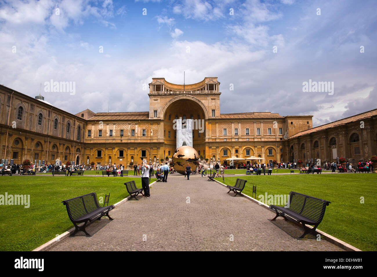 Benches on a walkway leading to a museum, Vatican Museums, Vatican City, Rome, Lazio, Italy Stock Photo