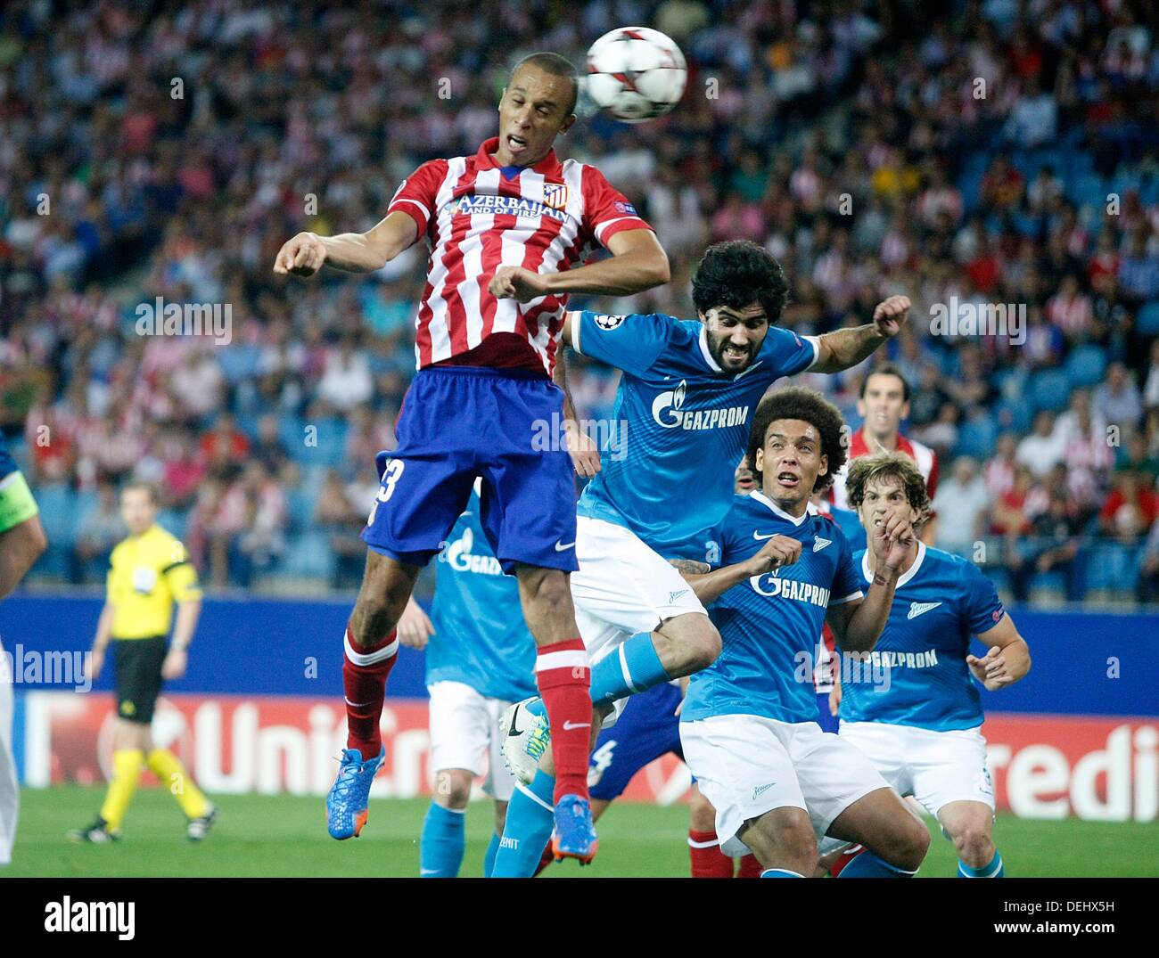 Madrid, Spain. 18th Sep, 2013. Atletico de Madrid's Joao Miranda (l) and Football Club Zenit's Luis Neto (c) and Axel Witsel during Champions League 2013/2014 match.September 18,2013. Foto © nph / Acero) Credit:  dpa picture alliance/Alamy Live News Stock Photo