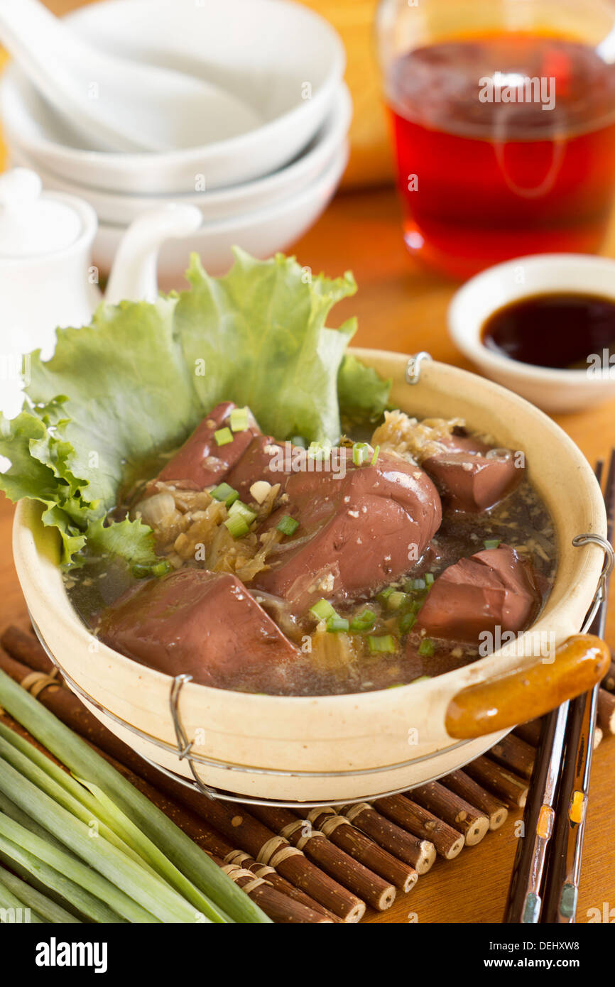 Blood Pudding Cubes in Clear Broth Stock Photo