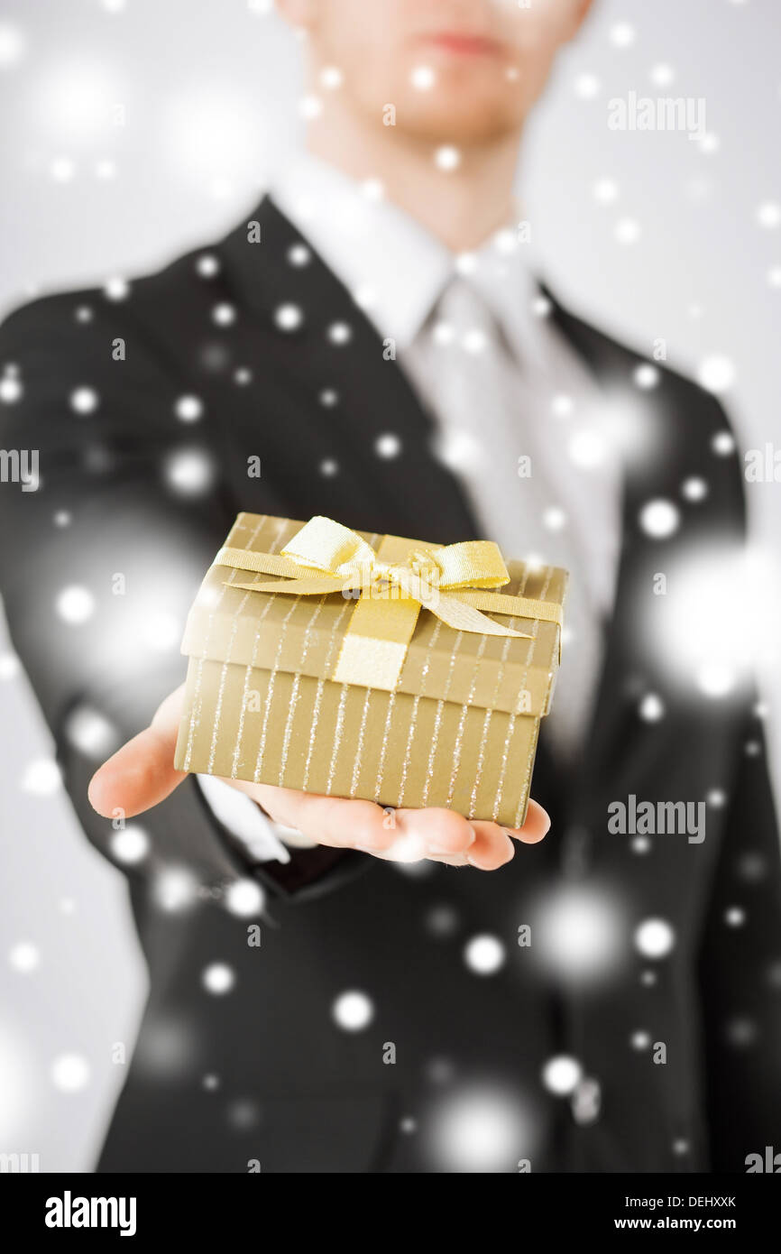 Man Giving Box man giving gift box Stock Photo - Alamy
