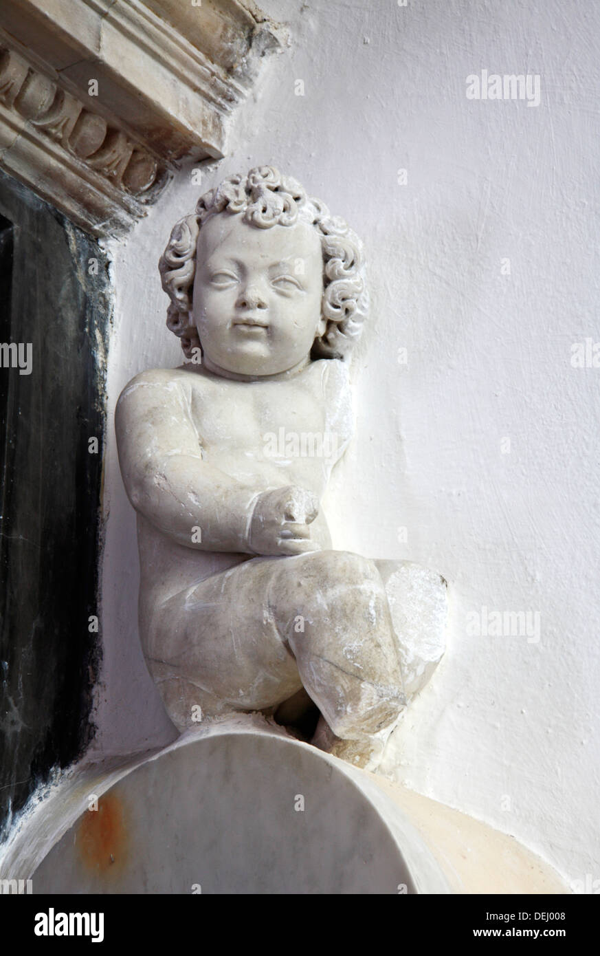 A carved stone cherub on the tomb of Lady Katherine Paston in the chancel of Oxnead church, Norfolk, England, United Kingdom. Stock Photo