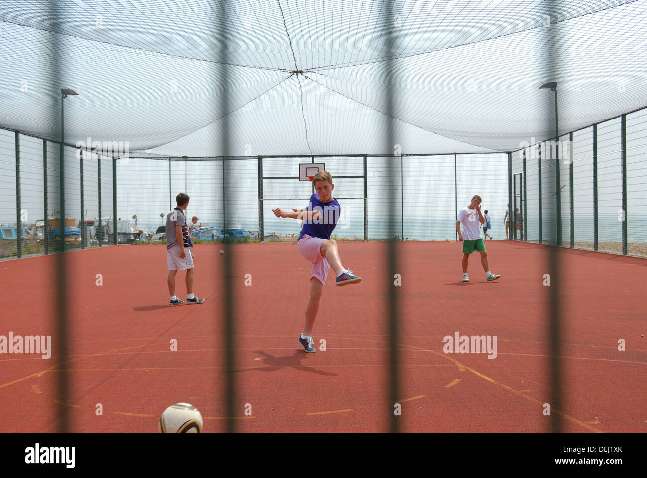 Kids play football, Hastings, United Kingdom Stock Photo Alamy
