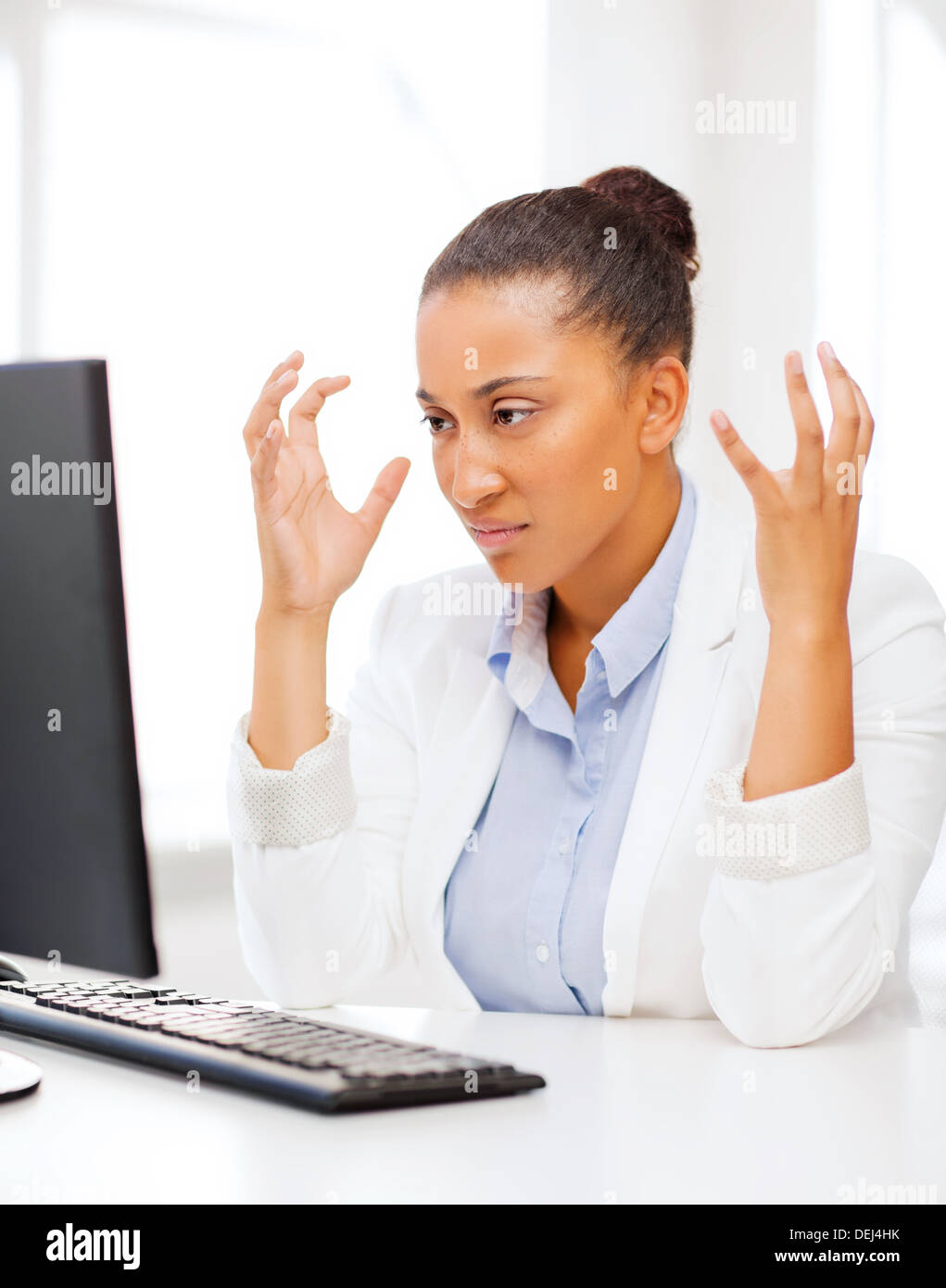 stressed african woman with computer Stock Photo - Alamy
