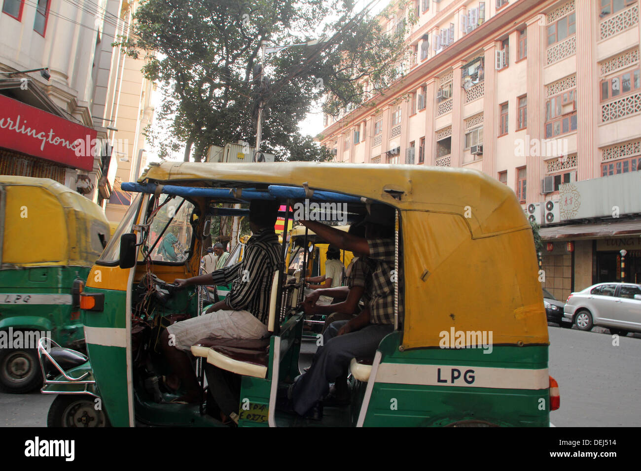 Auto rickshaw taxis on Nov 24, 2012, Mirza Ghalib Street, Kolkata, India. Stock Photo