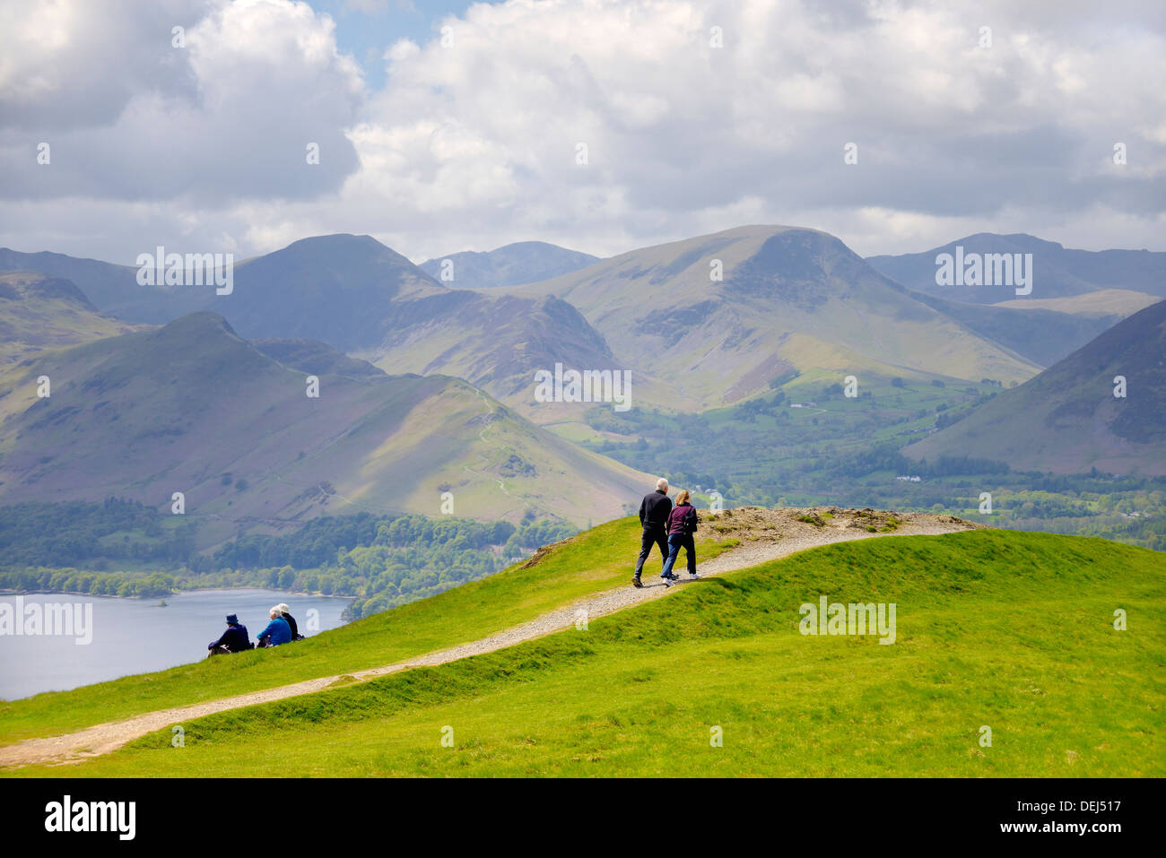 Walkers, Lake District National Park, England. On Latrigg fell above Keswick. Derwentwater, Cat Bells and Newlands Valley behind Stock Photo