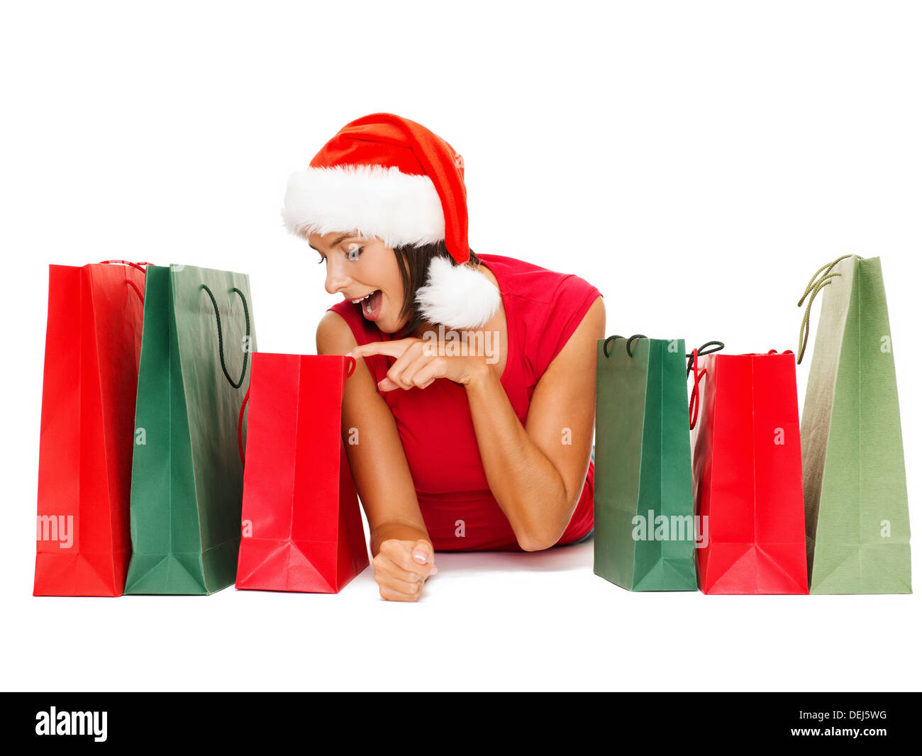 woman in red shirt with shopping bags Stock Photo