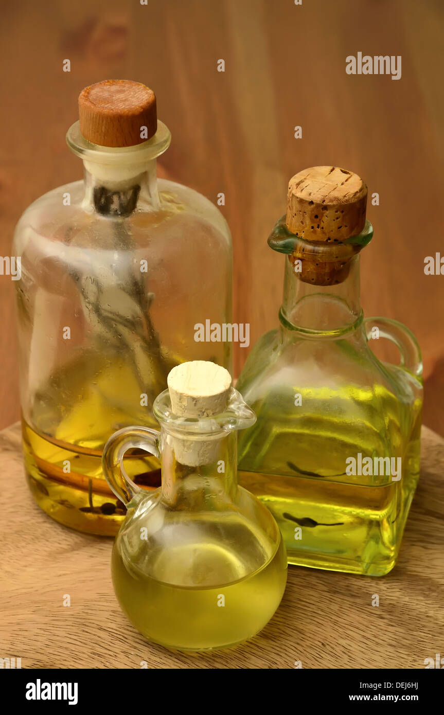 bottles with olive and herbal oil Stock Photo - Alamy