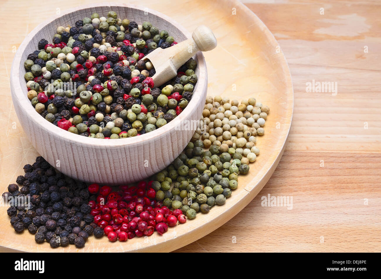 still life with black, red, green and white pepper and copy space Stock Photo